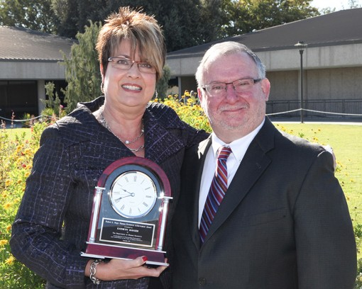 CDCR Officer of Employee Wellness Chief Kathy Manzer with the 2013 Robert L. Negri Human Resources Achievement Award, which was presented by CalHR Chief Deputy Director Howard Schwartz, right. Photo by CDCR staff photographer Eric Owens