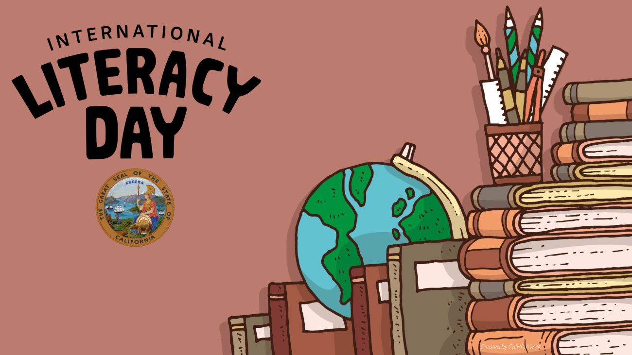Brown background with blue and green globe, stacks of books and a pen holder with various colors of writing utensils, a protractor and rulers. Black text reads International Literacy Day, state seal
